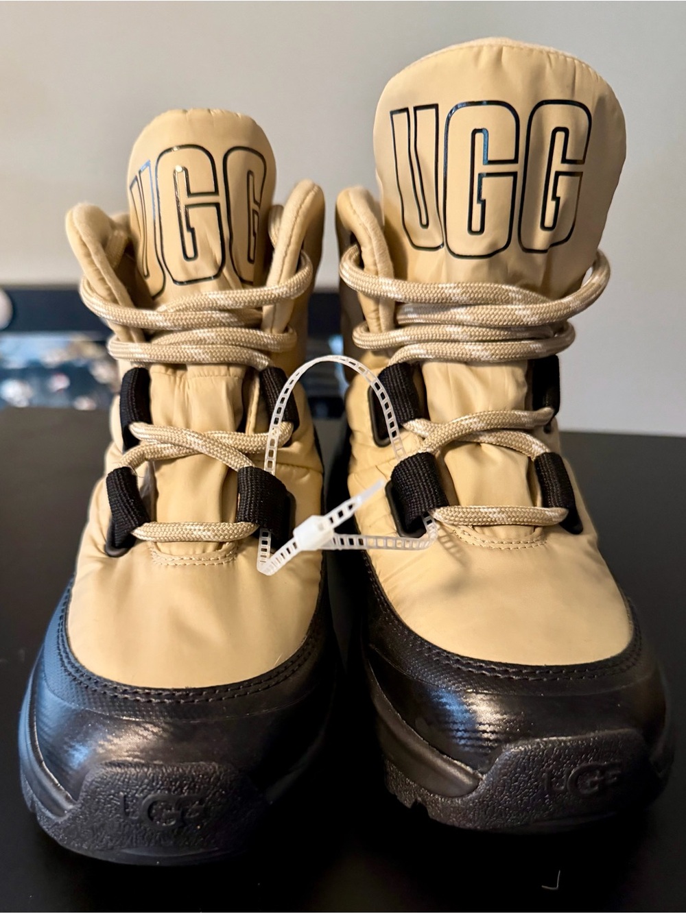 UGG Women's Yose Puffer Lace boots in the "Mustard Seed" color.
